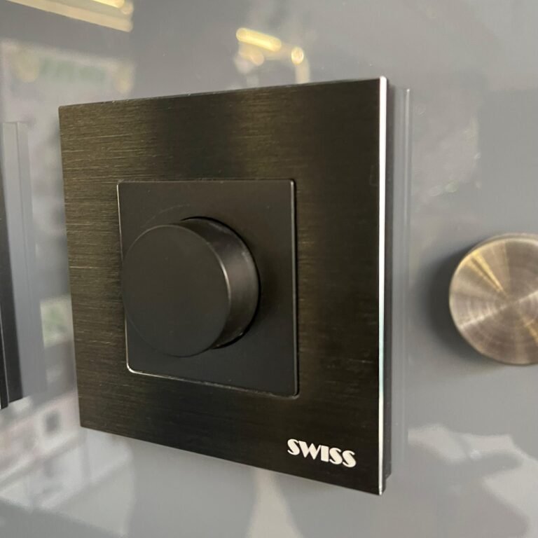 Swiss aluminium dimmer switch in black, on display