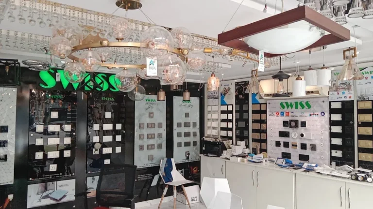 Inside our Lahore showroom: switch display boards under a green SWISS sign
